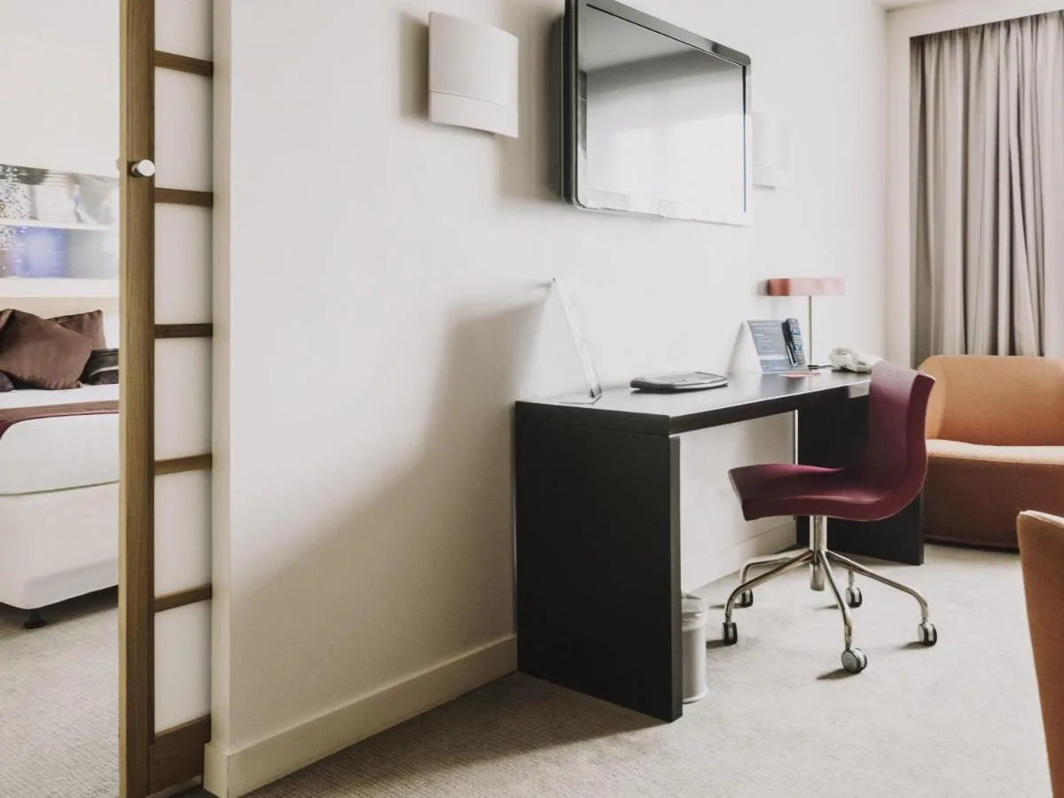 a room with a desk and a chair at Novotel Liverpool Centre in Liverpool